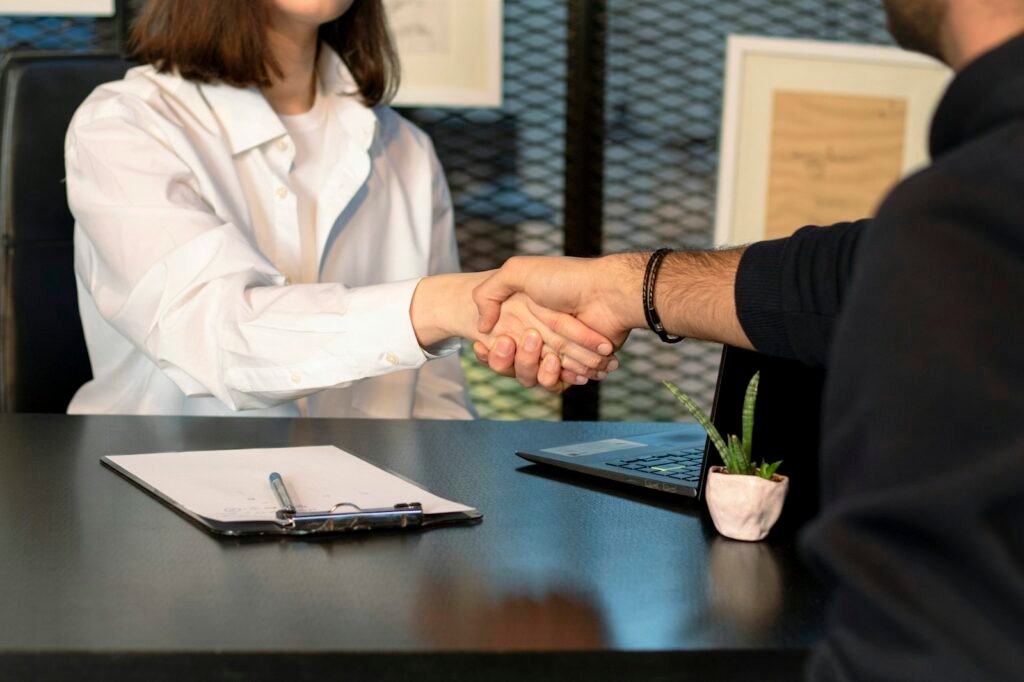 Business partners shaking hands at a meeting