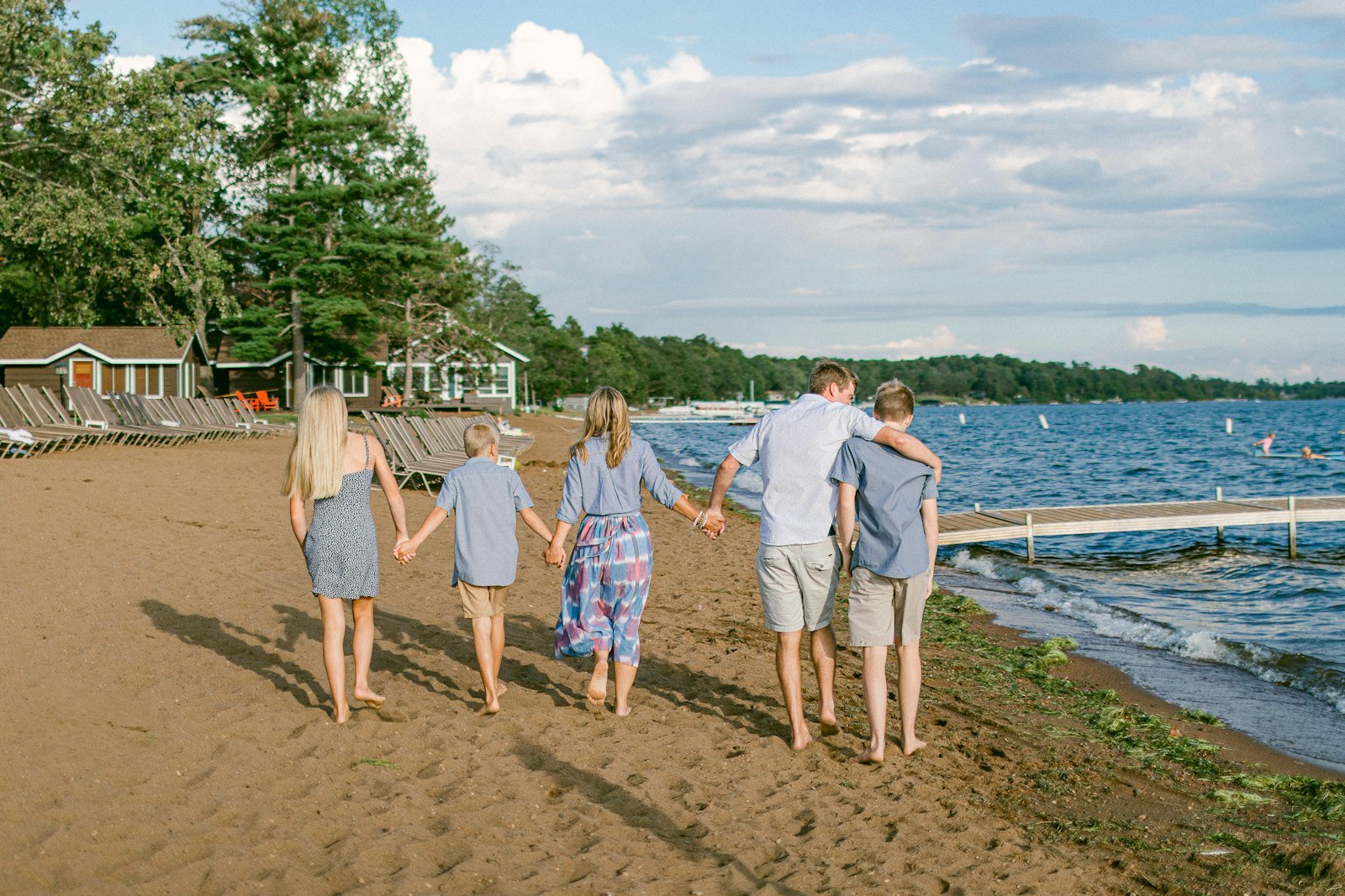 Family walking together on a beach during a holiday